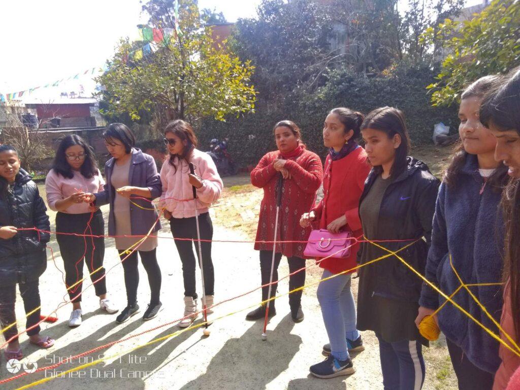 Participants playing game standing with each other